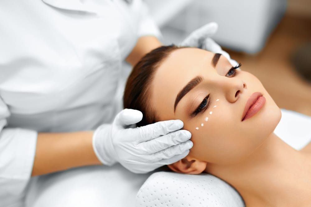 Skin Care. Cosmetic Cream On Woman's Face. Beauty Spa Treatment