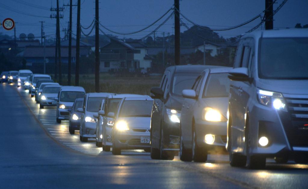 A traffic jam is seen as people evacuate after tsunami advisories were issued following an earthquake, in Iwaki