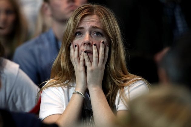 NEW YORK, NY - NOVEMBER 08: A woman reacts as she watches voting results at Democratic presidential nominee former Secretary of State Hillary Clinton's election night event at the Jacob K. Javits Convention Center November 8, 2016 in New York City. Clinton is running against Republican nominee, Donald J. Trump to be the 45th President of the United States.   Win McNamee/Getty Images/AFP == FOR NEWSPAPERS, INTERNET, TELCOS & TELEVISION USE ONLY ==