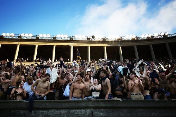 BOSTON, MA - NOVEMBER 19: Students cheer during the game between the Yale Bulldogs and the Harvard Crimson at Harvard Stadium on November 19, 2016 in Boston, Massachusetts.   Adam Glanzman/Getty Images/AFP